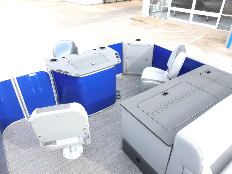 Slide: The Image of 2024 Bennington 22 SVF pontoon boat interior with seating and storage compartments. - 7