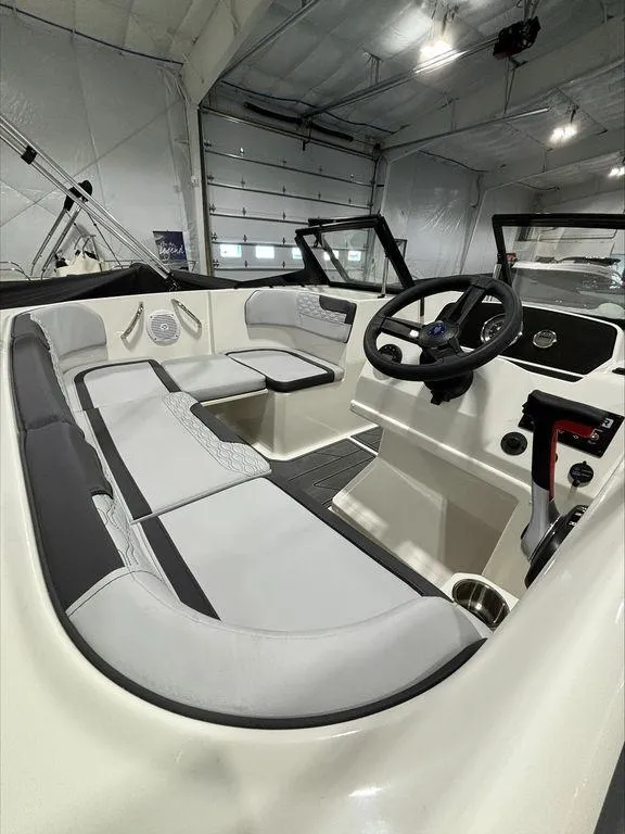 Slide: The Image of 2024 Bayliner M17 boat interior with modern seating and steering console. - 3