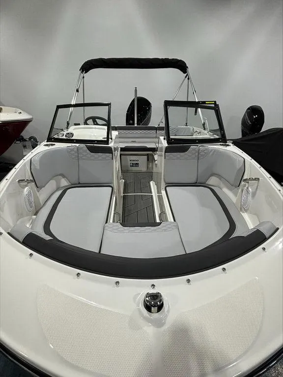 Slide: The Image of 2024 Bayliner M17 boat with open bow seating and modern interior design. - 7