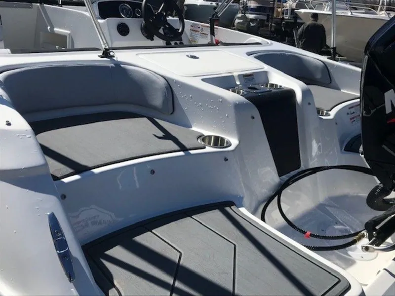 Slide: The Image of 2024 Bayliner M17 boat interior with seating and motor. - 10