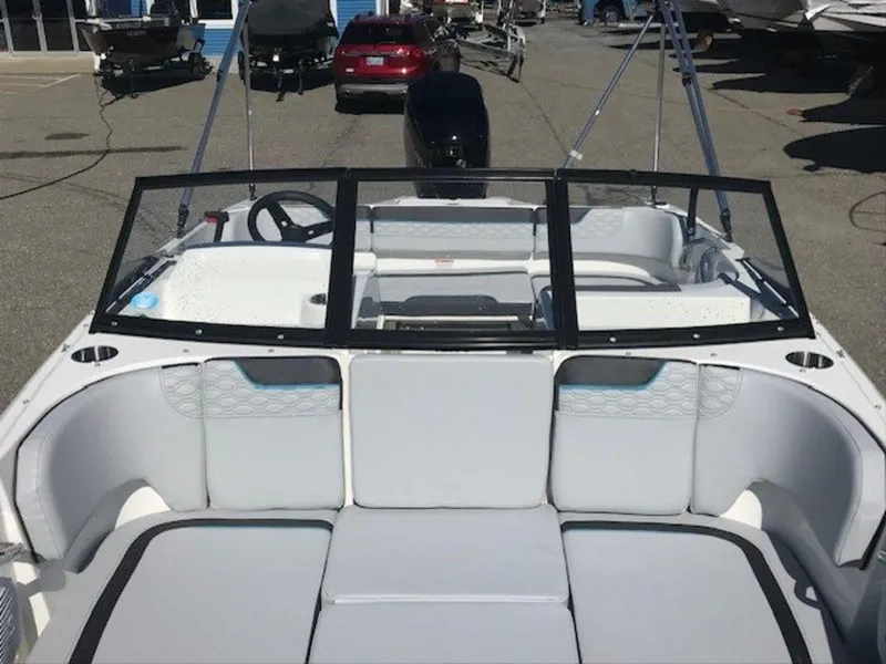 Slide: The Image of 2024 Bayliner M17 boat interior with seating and steering wheel. - 12