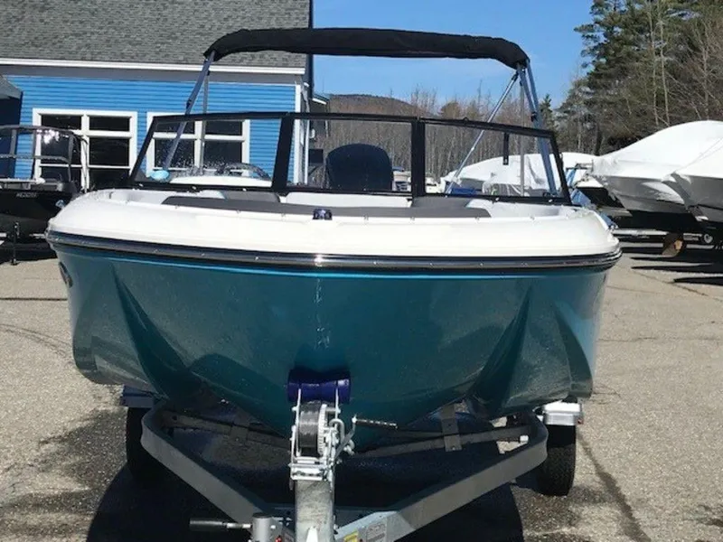 Slide: The Image of 2024 Bayliner M17 boat on trailer, front view, blue and white exterior. - 14