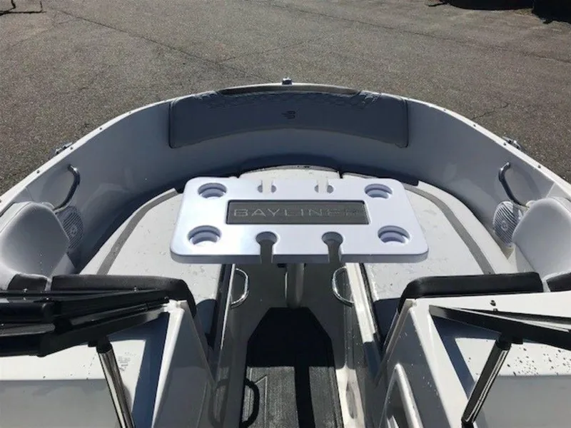 Slide: The Image of 2024 Bayliner M17 boat interior with seating and table. - 2