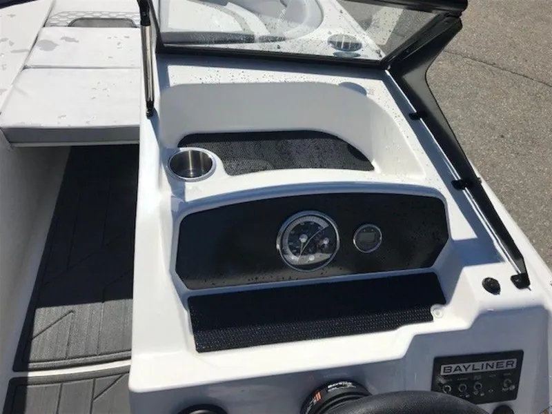 Slide: The Image of 2024 Bayliner M17 boat dashboard with steering wheel and instrument panel. - 6