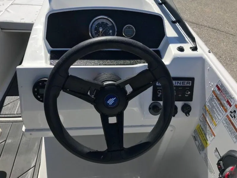 Slide: The Image of 2024 Bayliner M17 boat steering console with gauges and controls. - 8