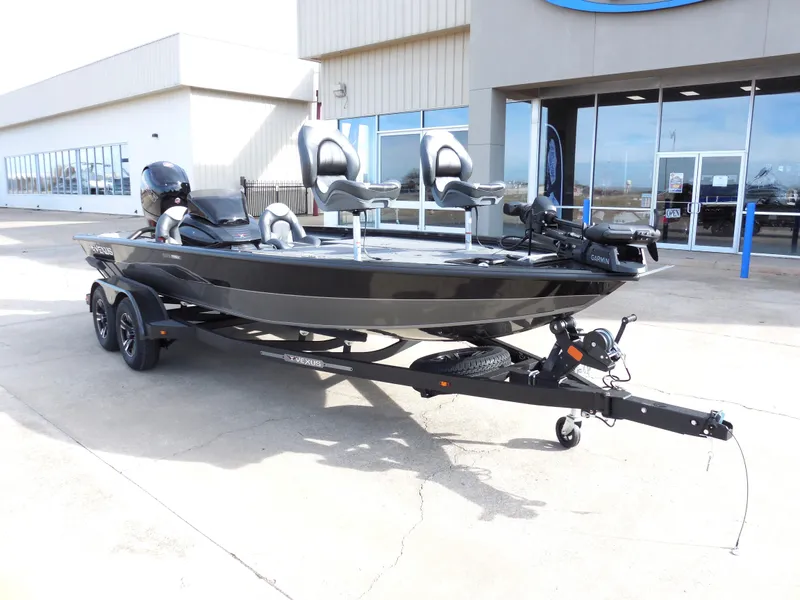 Slide: The Image of 2024 Vexus AVX 1980C fishing boat on trailer outside dealership. - 2