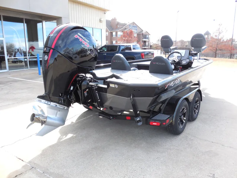 Slide: The Image of 2024 Vexus AVX 1980C boat with powerful outboard motor, parked on a trailer. - 3