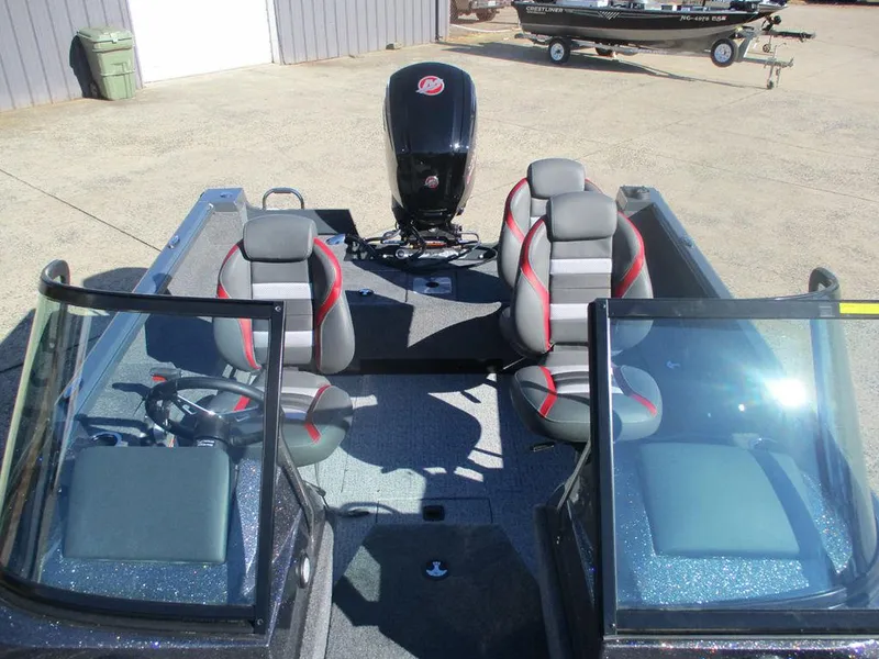 Slide: The Image of 2024 Ranger VS1682SC Angler boat interior with seating and motor. - 9