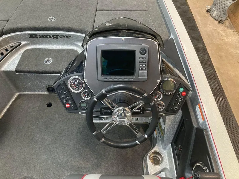 Slide: The Image of 2014 Ranger Z521C boat dashboard with steering wheel and electronic display. - 7