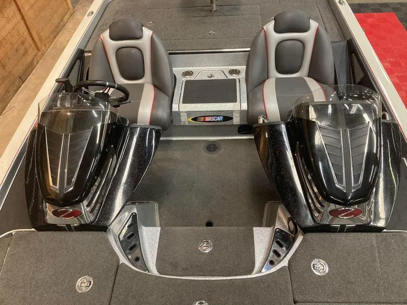 Slide: The Image of 2014 Ranger Z521C boat interior with dual seats and steering consoles. - 9