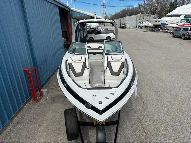 Slide: The Image of 2024 Crownline 260 SS boat on trailer outdoors. - 36