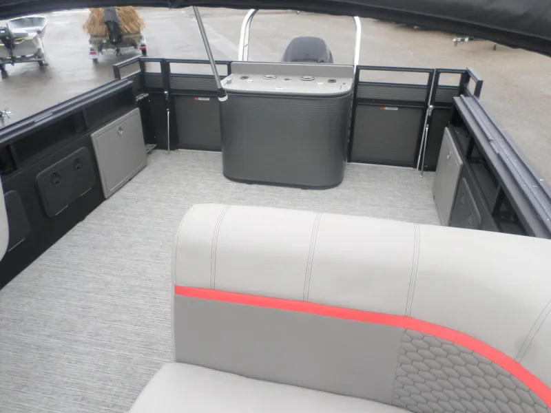 Slide: The Image of 2024 Angler Quest 8524 Family Fish LTZ boat interior with seating and storage compartments. - 2