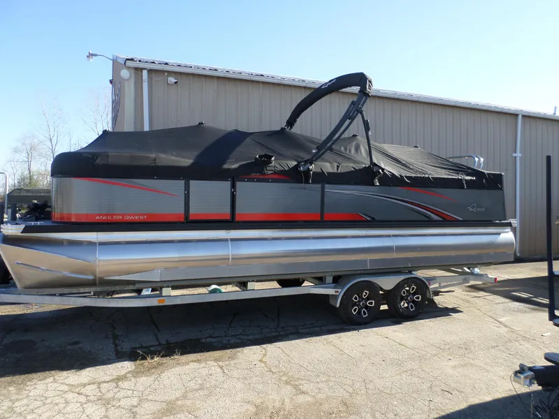 Slide: The Image of 2024 Angler Qwest Pontoons 8524 Family Fish LTZ on trailer, covered and parked outdoors. - 4