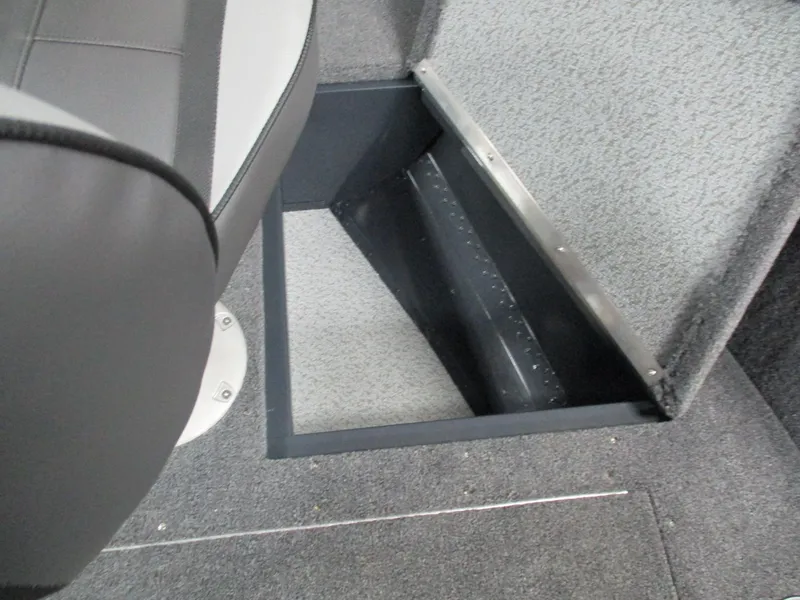 Slide: The Image of 2024 Lund 1650 Rebel XL Sport boat interior storage compartment. - 10