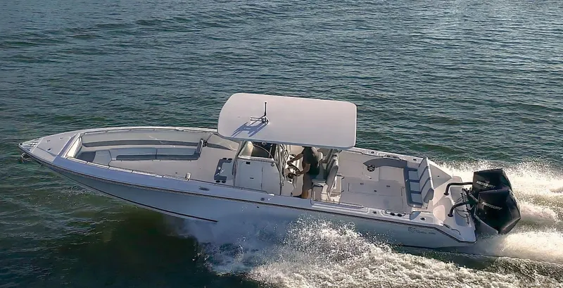 Slide: The Image of 2025 Marlago 35SS boat cruising on open water. - 1