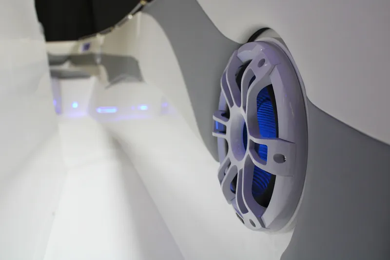 Slide: The Image of Marlago 35SS 2025 boat interior with blue-lit speaker detail. - 6