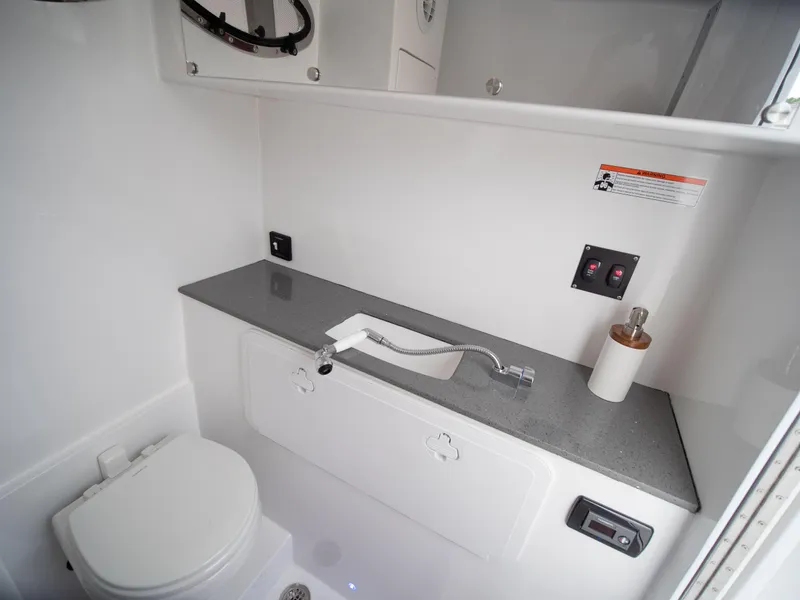 Slide: The Image of 2025 Marlago 35SS boat bathroom with modern fixtures and sleek design. - 7