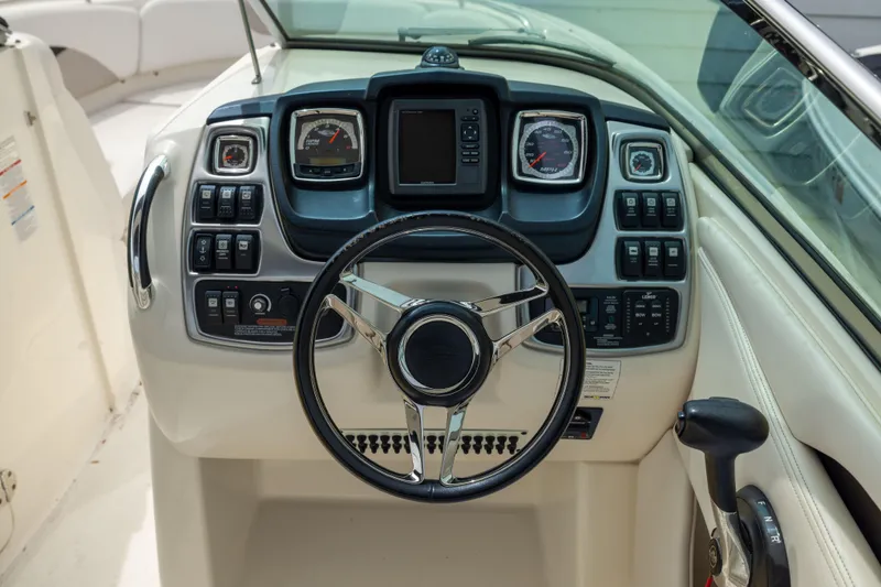 Slide: The Image of Steering console of 2015 Chaparral 287 SSX boat with gauges and controls. - 10