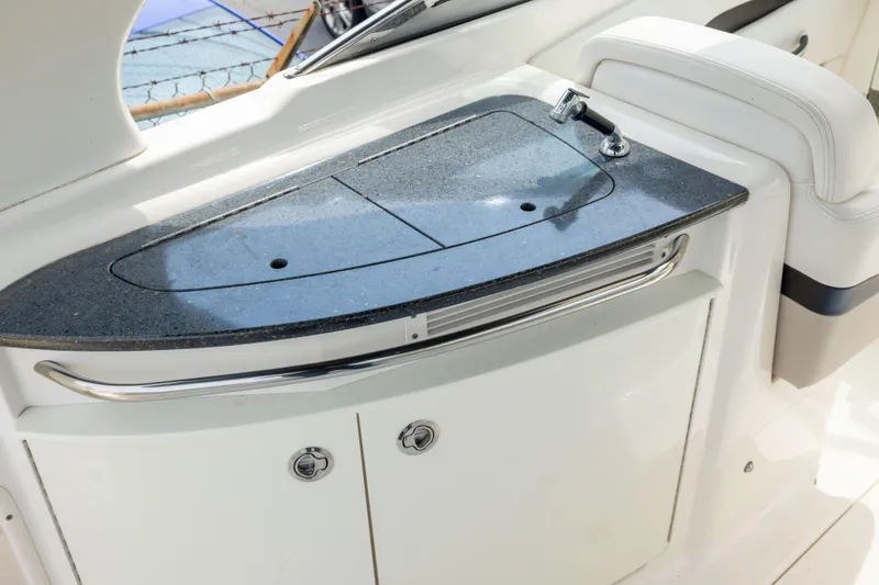 Slide: The Image of 2015 Chaparral 287 SSX boat interior with sleek countertop and built-in sink. - 13
