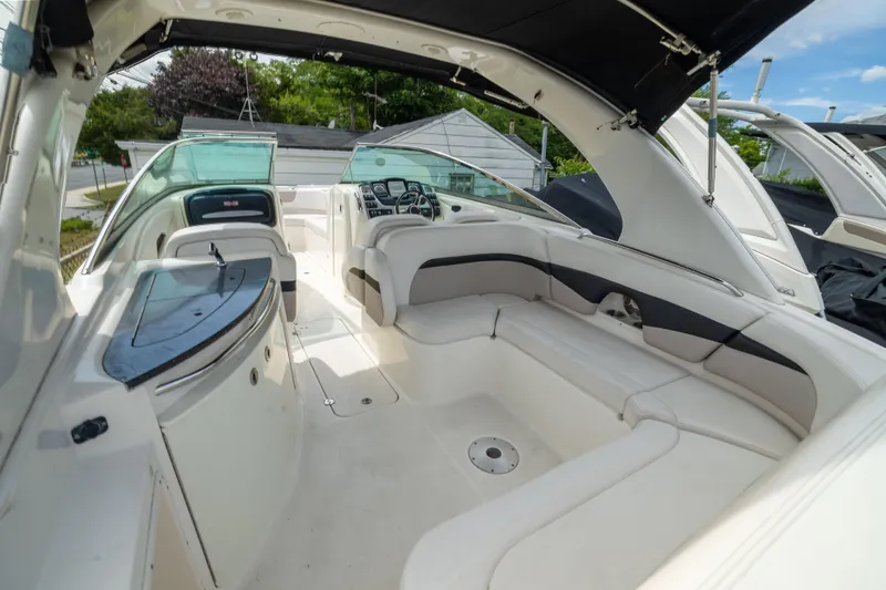 Slide: The Image of 2015 Chaparral 287 SSX boat interior with spacious seating and modern dashboard. - 6