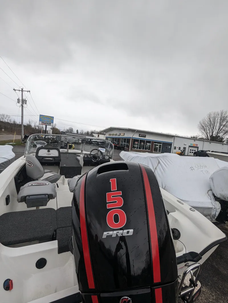 Slide: The Image of 2024 Triton 186 Allure boat with 150 Pro engine in dealership lot. - 16