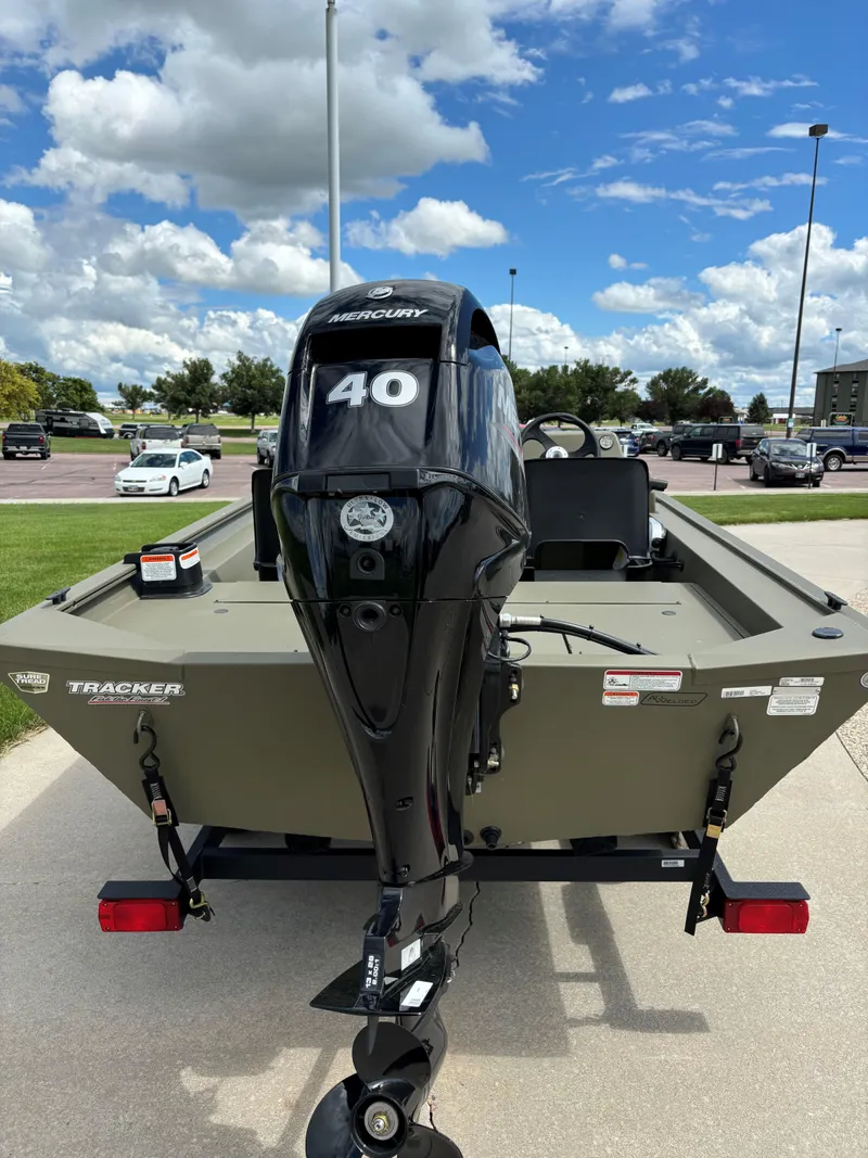 Slide: The Image of 2024 Tracker Grizzly 1754 SC boat with Mercury 40 HP outboard motor. - 2