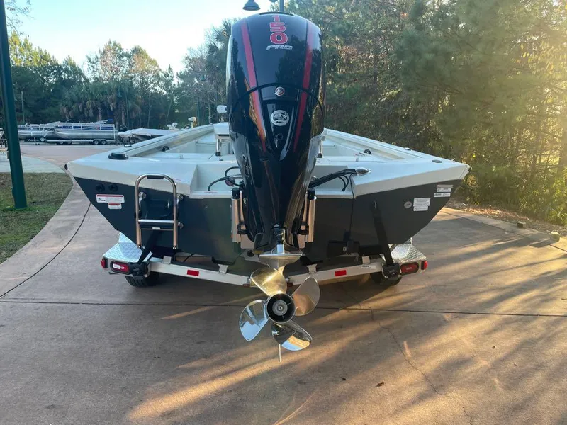 Slide: The Image of 2024 Ranger RB200 boat with powerful outboard motor on a trailer. - 2