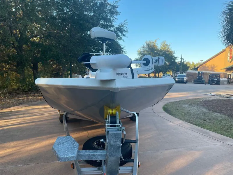 Slide: The Image of 2024 Ranger RB200 boat on trailer, featuring Minn Kota motor, parked outdoors. - 3