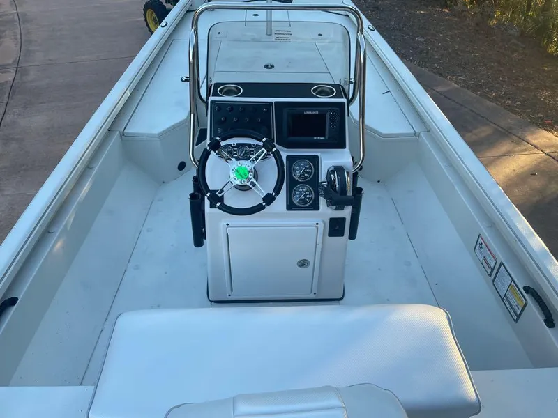 Slide: The Image of 2024 Ranger RB200 boat interior with steering console and seating. - 5