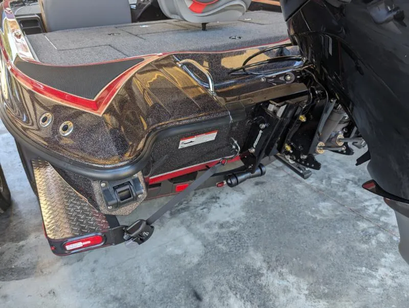 Slide: The Image of 2024 Triton 18 TrX boat rear view, showcasing motor and sleek design. - 8