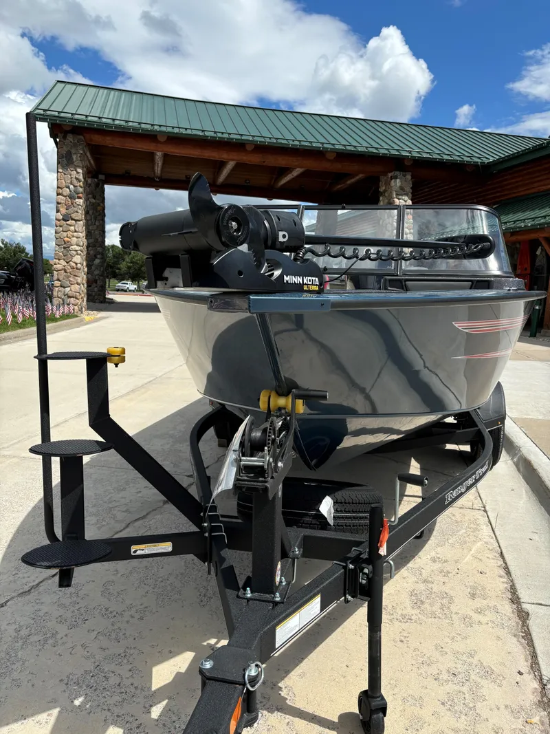 Slide: The Image of 2024 Ranger VX1788 WT fishing boat on a trailer, parked outdoors. - 2