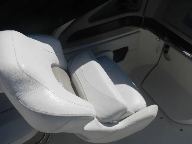 Slide: The Image of White leather seat in a 2009 Larson 238 LXi boat. - 11