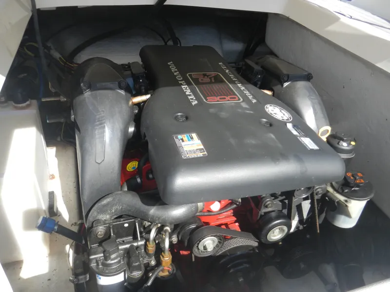 Slide: The Image of 2009 Larson 238 LXi boat engine compartment with Volvo Penta engine. - 15