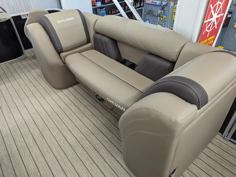 Slide: The Image of 2024 Sylvan Mirage Fish 8522 Party Fish boat interior seating, beige and brown upholstery. - 4