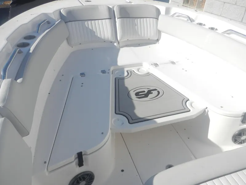 Slide: The Image of 2024 Sea Fox 248 Commander boat interior with spacious seating and storage. - 6