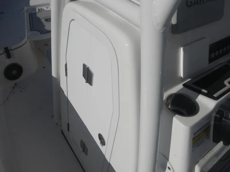 Slide: The Image of 2024 Sea Fox 248 Commander boat console with storage compartment and cup holder. - 7