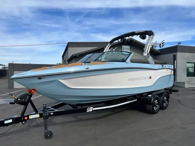 Slide: The Image of 2024 MasterCraft XT23 boat in a pool, front view. - 2