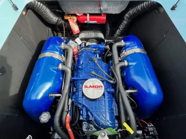 Slide: The Image of 2024 MasterCraft XT23 boat interior with tan and blue seating, modern design. - 20