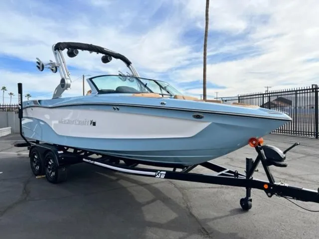 Slide: The Image of 2024 MasterCraft XT23 boat in a pool, showcasing sleek design and modern features. - 4