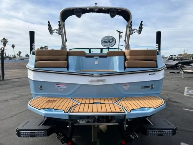 Slide: The Image of 2024 MasterCraft XT23 boat in a pool, featuring sleek design and modern amenities. - 7