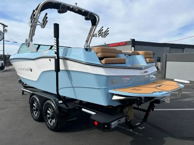 Slide: The Image of 2024 MasterCraft XT23 boat in a pool, showcasing sleek design and modern features. - 8