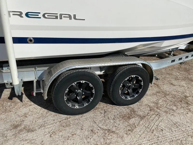 Slide: The Image of 2017 Regal 22 FasDeck boat on a dual-axle trailer. - 15