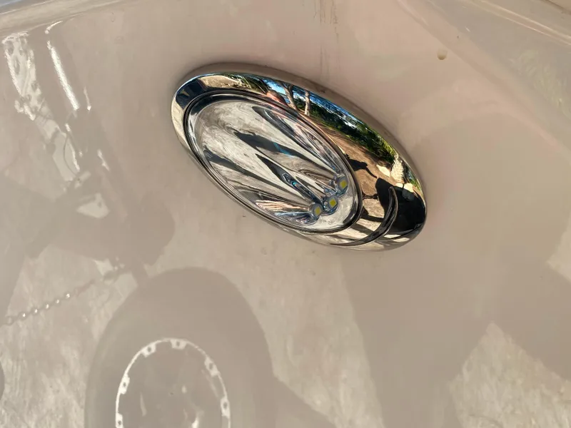 Slide: The Image of Close-up of a 2017 Regal 22 FasDeck boat emblem. - 19