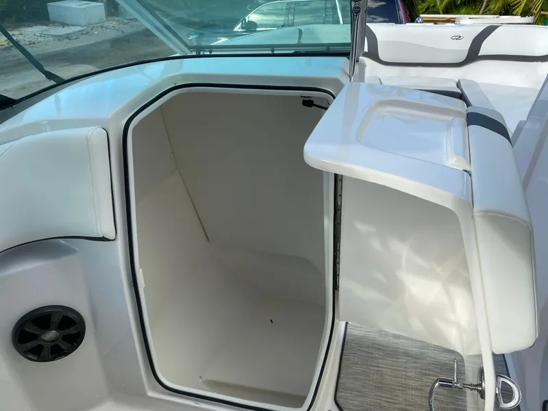 Slide: The Image of 2017 Regal 22 FasDeck boat interior with open storage compartment. - 34