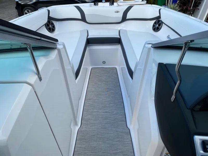 Slide: The Image of 2017 Regal 22 FasDeck boat interior with white and gray seating. - 36