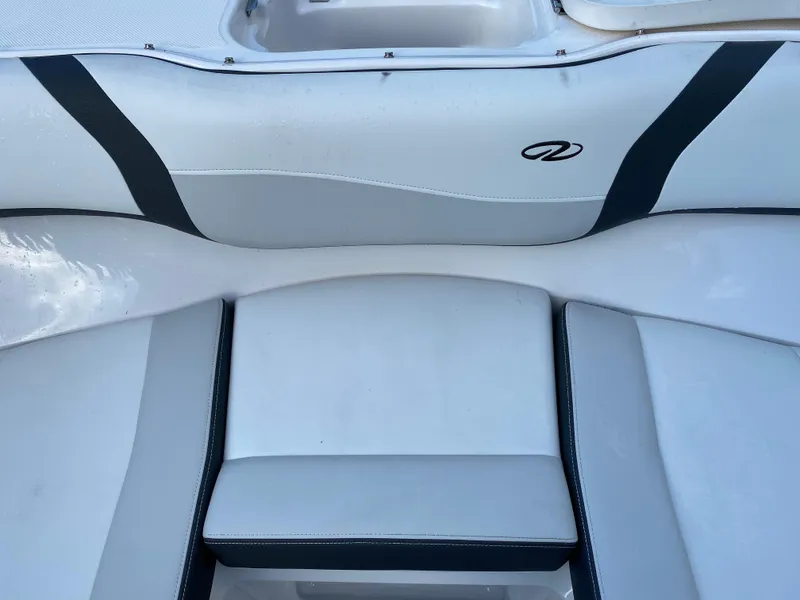 Slide: The Image of 2017 Regal 22 FasDeck boat interior seating with logo. - 39