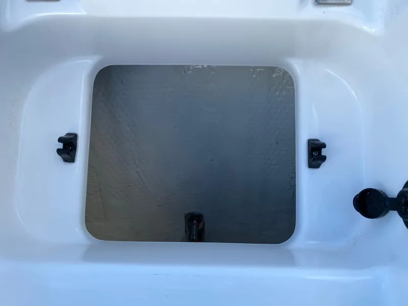 Slide: The Image of Open storage compartment of 2017 Regal 22 FasDeck boat. - 41