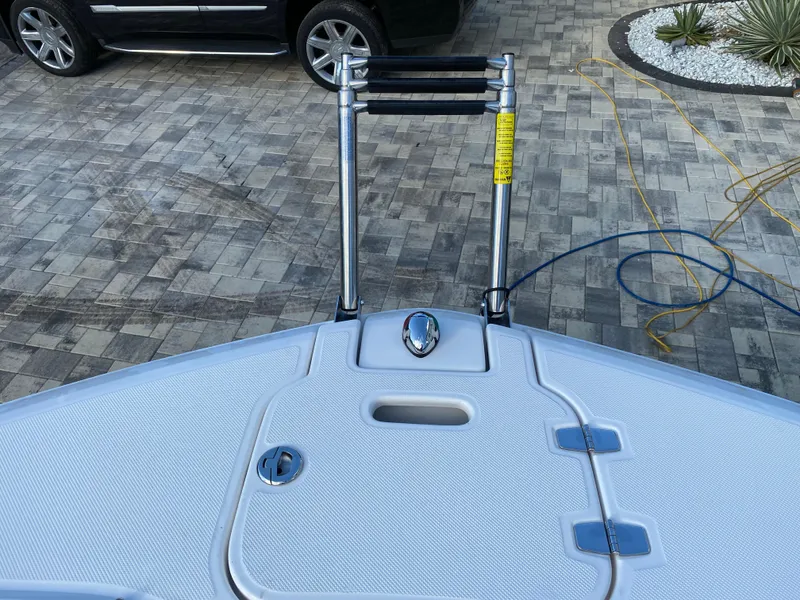 Slide: The Image of 2017 Regal 22 FasDeck boat bow with ladder and storage compartment. - 43