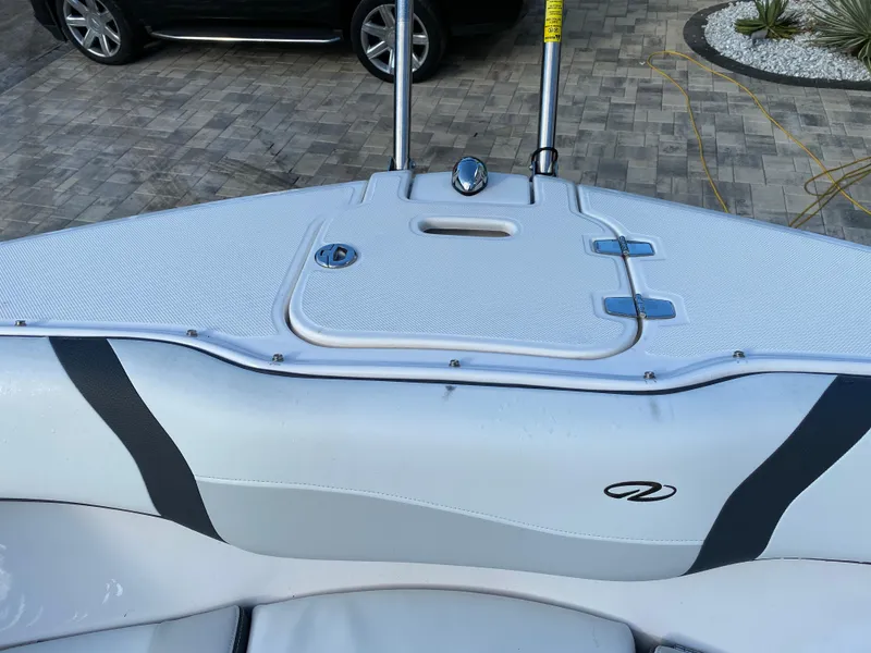 Slide: The Image of 2017 Regal 22 FasDeck boat interior with sleek design and storage compartment. - 44