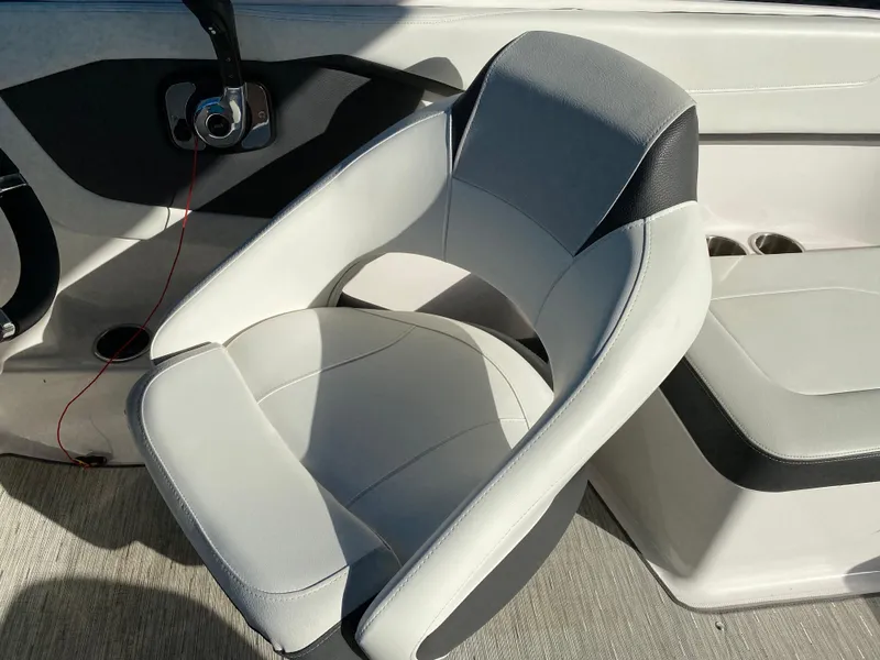 Slide: The Image of 2017 Regal 22 FasDeck boat interior with gray and black seating. - 47